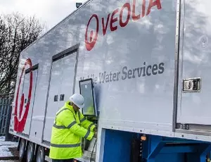 Veolia technician working on mobile water truck