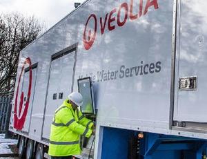 Veolia technician working on mobile water truck