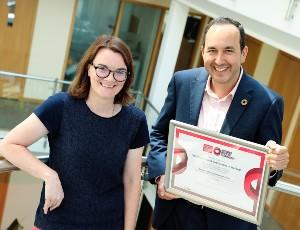 Tomás Sercovich, CEO of Business in the Community Ireland, presenting the updated Business Working Responsibly Mark to Sinéad Patton, Chief Financial and Commercial Officer of Veolia Ireland